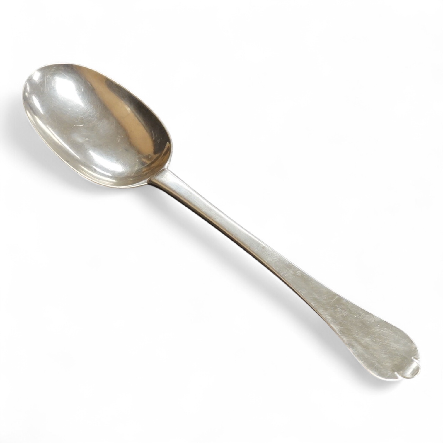 A late William III Britannia standard silver trefid spoon, by William Scarlett, London, 1701, with rat-tail bowl and later? engraved crest, 19.7cm, 52 grams.